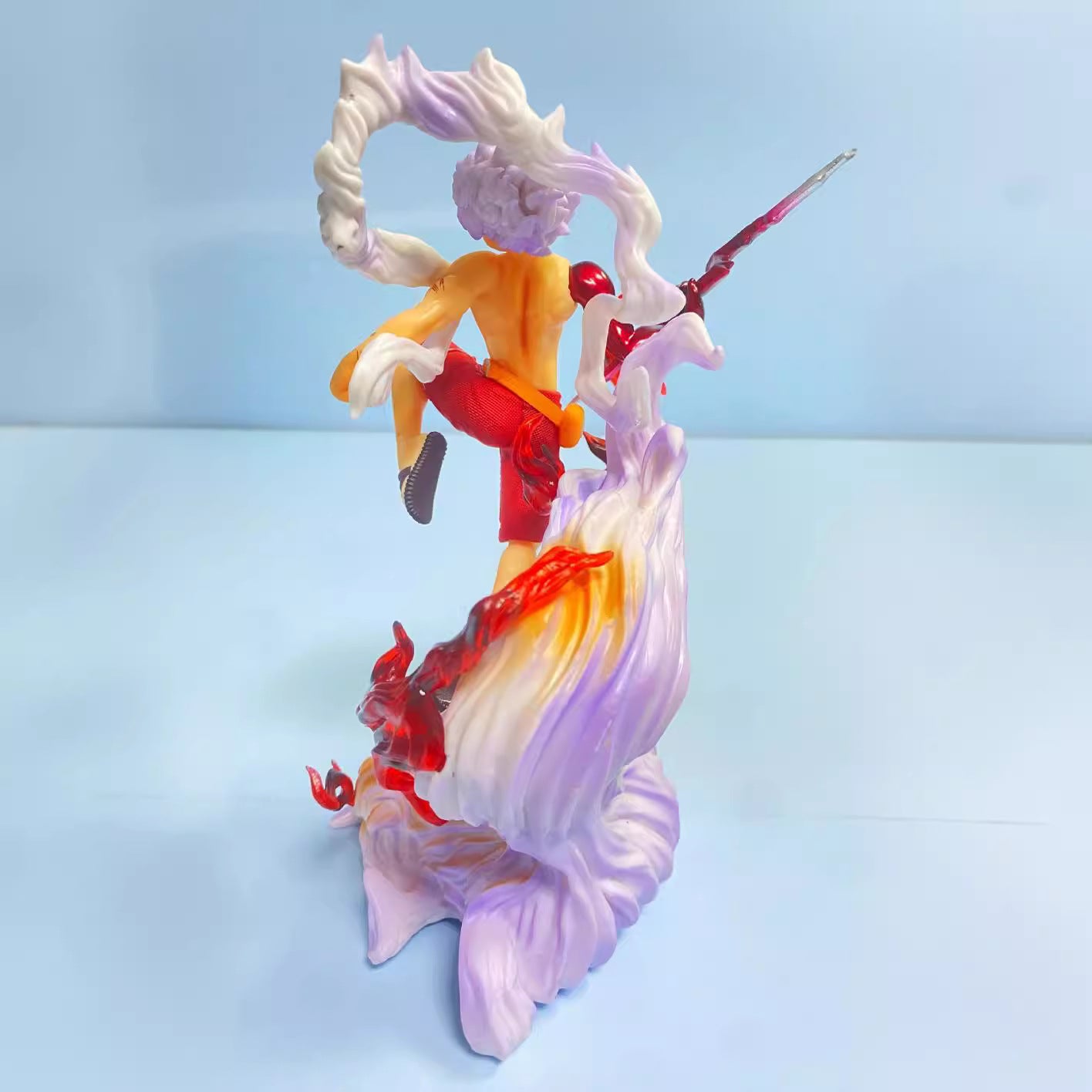Colorful figurine with a character on a light blue background