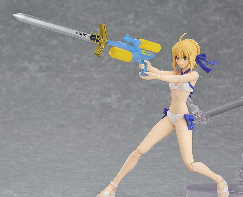Action figure of a character holding a sword and gun on a gray background