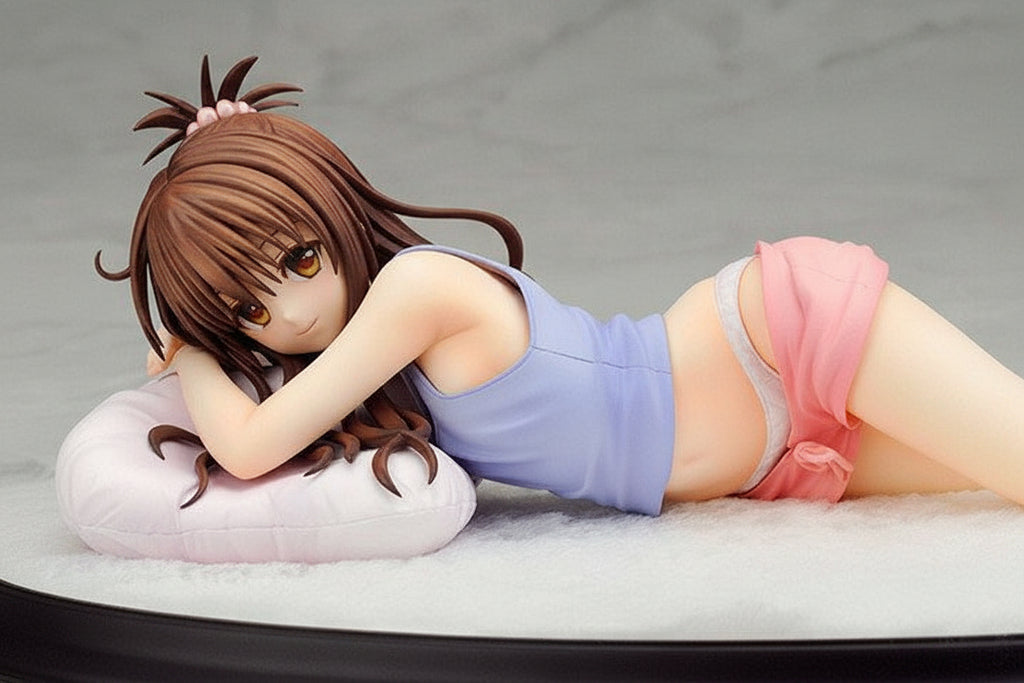 Figurine of a character lying on a bed with a gray background