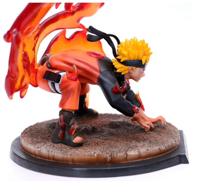 Action figure of a character with fiery effects on a white background