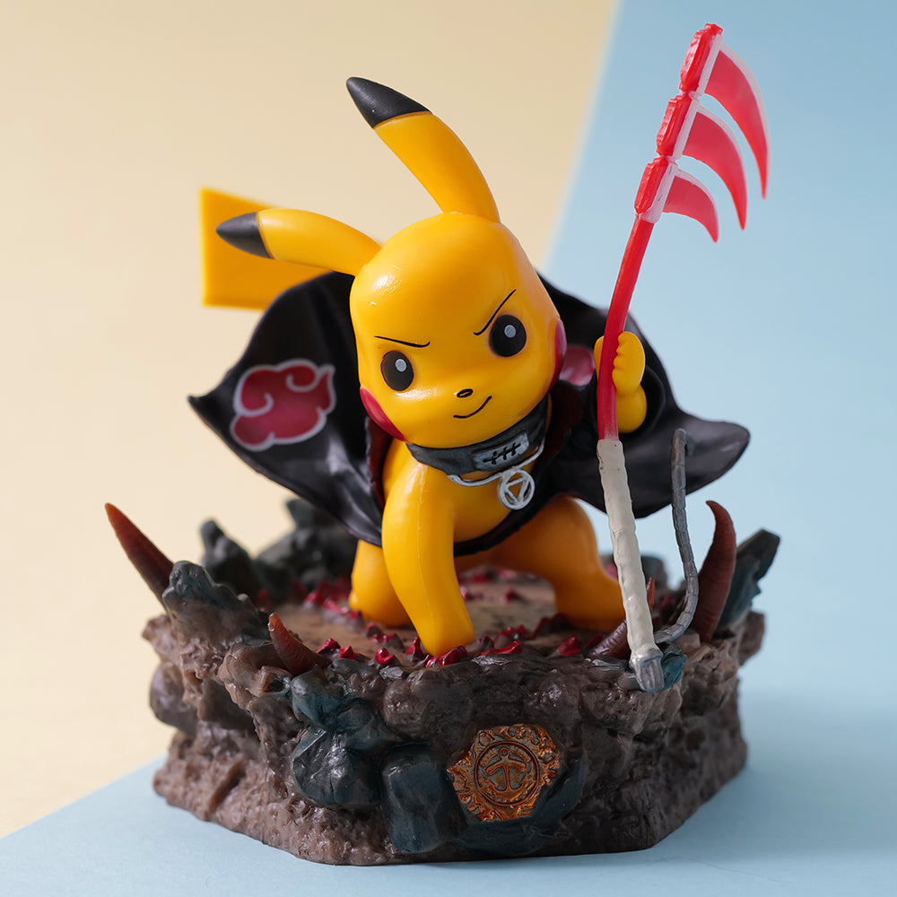 Pikachu figurine with a black cape and red flag on a decorative base