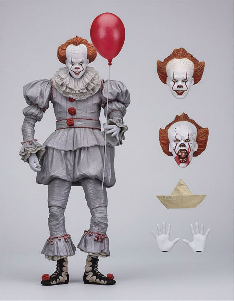Action figure of a clown with a red balloon, including interchangeable faces and accessories, on a white background.