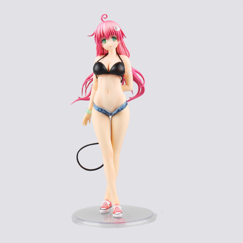 Figure of a character with pink hair and a black bikini top on a gray background