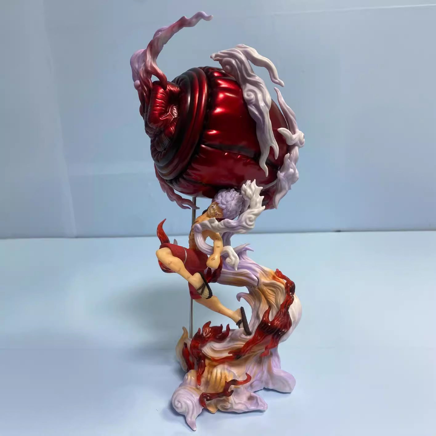 Colorful figurine with dynamic pose on a white background