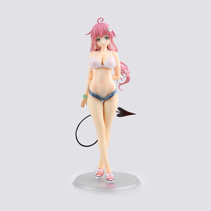 Figure of a character with pink hair and a swimsuit on a white background