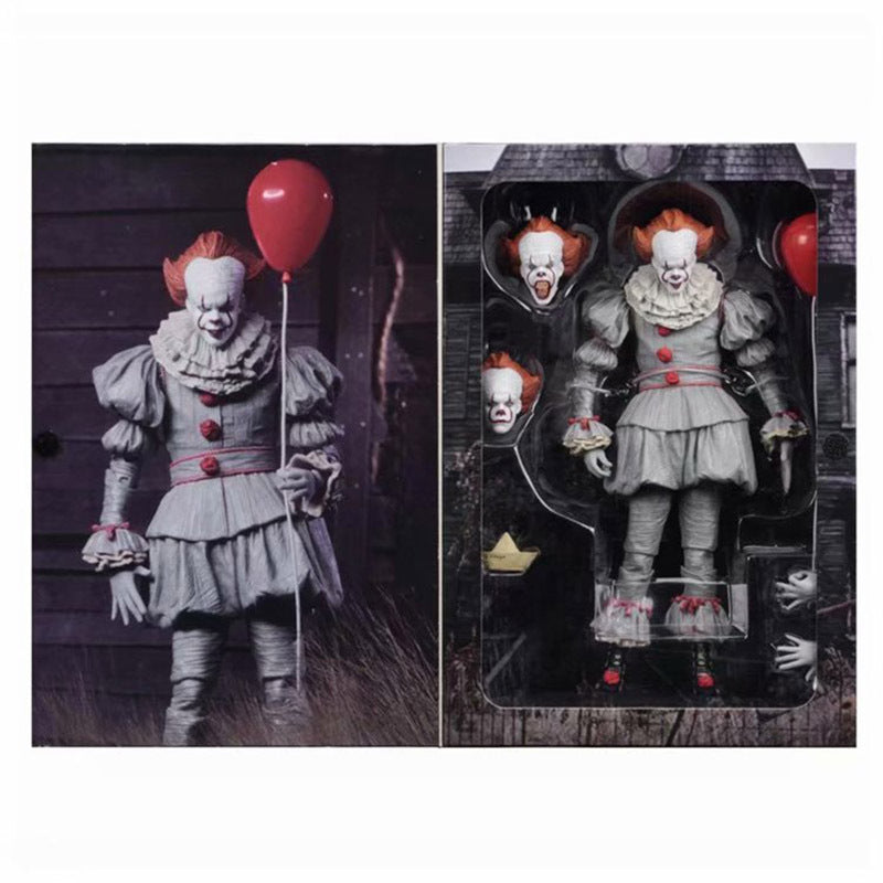 Action figure of a clown holding a red balloon with packaging in the background