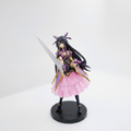 Anime figurine with long black hair, purple and pink outfit, and a sword on a white background