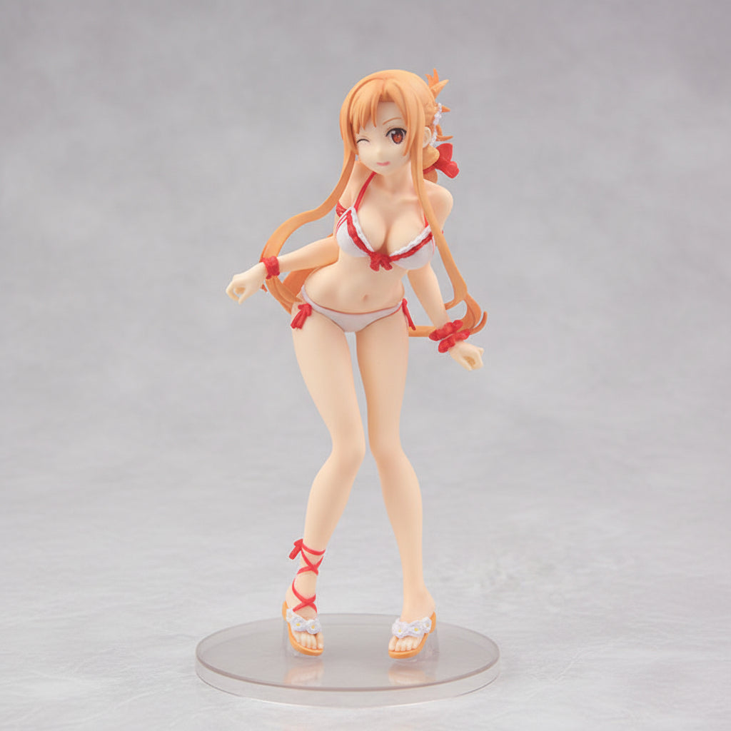 Figurine of a character with long orange hair and a red bikini on a dark background