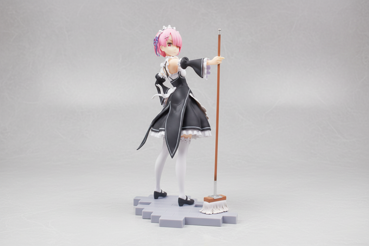 Anime character figurine with pink hair and a staff on a dark background